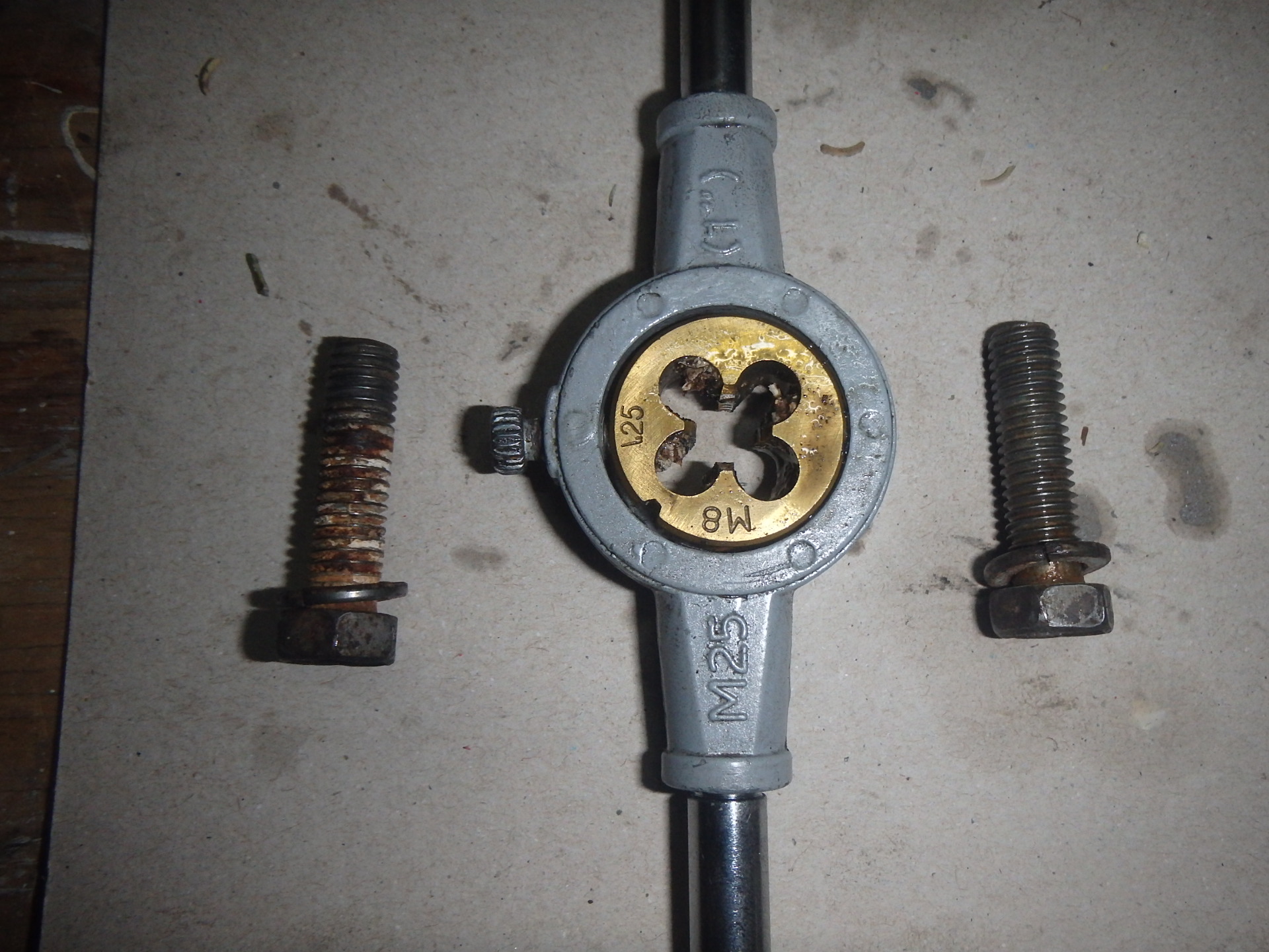 Running cam bolts through die